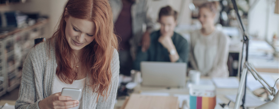 woman looking at her phone
